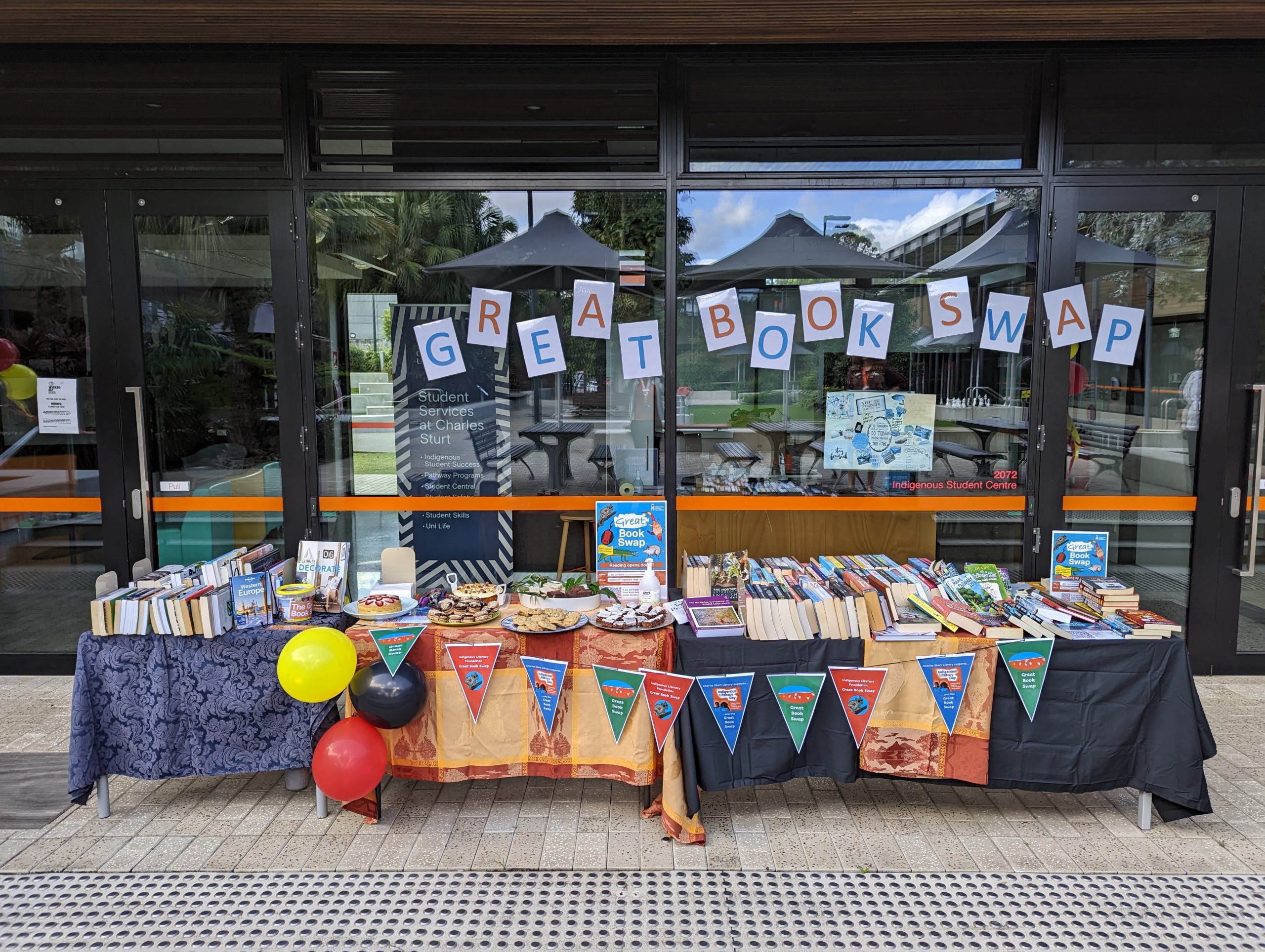 Cake and books stall at the Great Book Swap in Port Macquarie.
