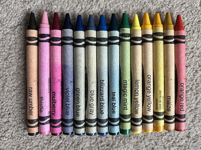 An aray of Crayola Retired Crayon colours all lined up so you can see their names (CC0)